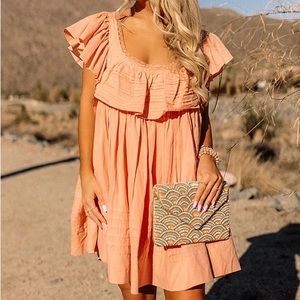 Peach colored backless mini dress